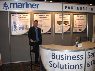 Jarett Nickerson standing in front of the Mariner Booth at the 2009 Think NB tradeshow