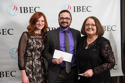 Marilyn Davis (far right), MBA Programs Assistant, presents the award for Viewer's Choice Best Elevator Pitch, to members of the Doctor's Orders team, Joanna Nickerson and Zachary Robson.