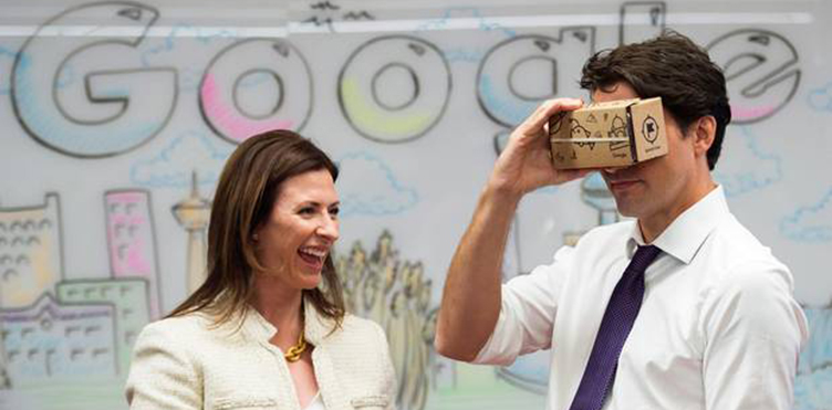 Prime Minister Justin Trudeau, right, and Jennifer Flanagan, President and CEO of Actua, take part in a virtual reality demonstration at the new Google Canada Development headquarters in Kitchener-Waterloo, Ontario. (Nathan Denette/The Canadian Press)