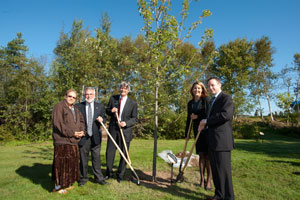Participants of the tree-planting event, from left to right: Maggie Paul, First Nation elder; Don Floyd, dean of Forestry and Environmental Management, UNB; Peter Curtis, TD Friends of the Environment; Natalie Young, TELUS; and Gary MacIntosh, director of marketing, Royal Canada, Irving Consumer Products.