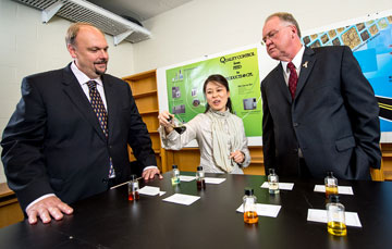 UNB's newest CRC recipient, Ying Zheng (centre), shows David Burns, vice-president research at UNB (left); and Minister Keith Ashfield, Member of Parliament for Fredericton (right) her research lab.