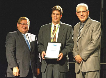 Transportation and Infrastructure Minister Claude Williams; University of New Brunswick professor Eric Hildebrand, and Doug McNeil, president of the Transportation Association of Canada.