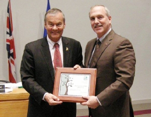 Fredericton Mayor Brad Woodside presents the mayor's environmental award to Dr. Tony Secco, UNB's Vice-President (Fredericton).