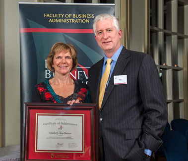 Rob Austin, Dean, presenting the 2012 Certificate of Achievement to Kim MacPherson (BBA '84), Auditor General of New Brunswick, at the 25th Business Awards Dinner