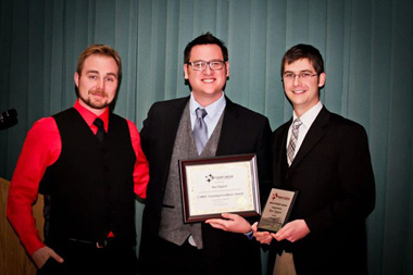 Ben Tippett accepting the 2012-13 UNB Student Union Teaching Excellence Award. He was nominated by students, Mike Bremner (pictured left) and Mitch Dionne (right).