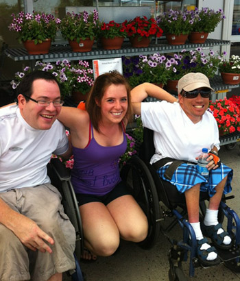 Natasha Larivee, co-president of Best Buddies-UNB Fredericton (centre) with her Best Buddies, Robbie (left) and Corey (right)