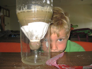 A World's UNBound camper testing his water filter