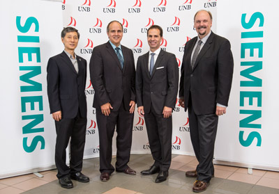 From left to right: Dr. Liuchen Chang, professor of electrical and computer engineering, University of New Brunswick; Gaetan Thomas, president & CEO, NB Power; Robert Hardt, president & CEO, Siemens Canada Limited; David Burns, Vice President (Research), University of New Brunswick.
