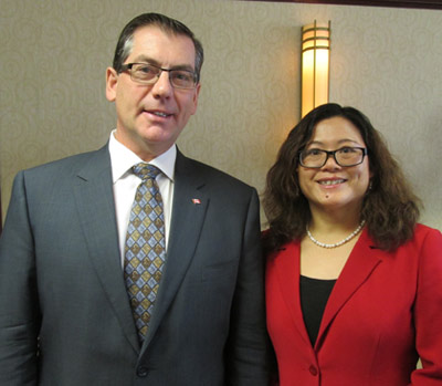 The Honourable Kevin Sorenson (left), minister of state for finance and Dr. Weiqiu Yu (right), chair of economics at the University of New Brunswick