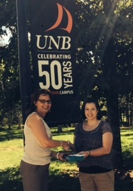 Dr. Karen Furlong, senior teaching associate at UNB Saint John presents Laura Sullivan with the iPad Mini.