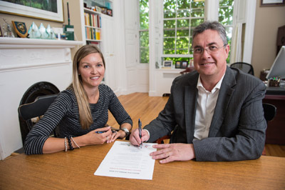 Sue O’Donnell of UNB’s Nursing Faculty (left) helped organize a presentation series as part of Respectful Workplace Week. UNB President Eddy Campbell signs a declaration proclaiming Sept. 6 to 12 Respectful Workplace Week at the university.