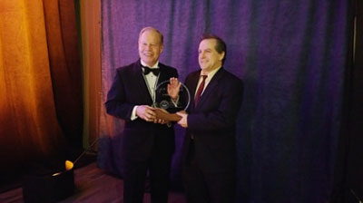 Dr. Dave Lentz (right), PGeo, accepts the L.W. Bailey Award from outgoing APEGNB President Paul Campbell, PEng (left)