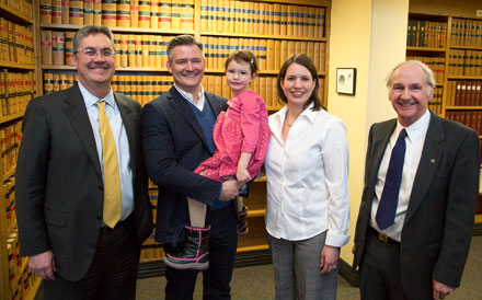 Left to right: UNB President, Eddy Campbell; Vaughn MacLellan holding his daughter Maggie; Tiffany Jay; and UNB Dean of Law, John Williamson.