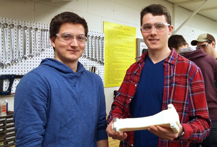 Lucas Pupek and Trevor Scott with the 3D-printed mold of their device