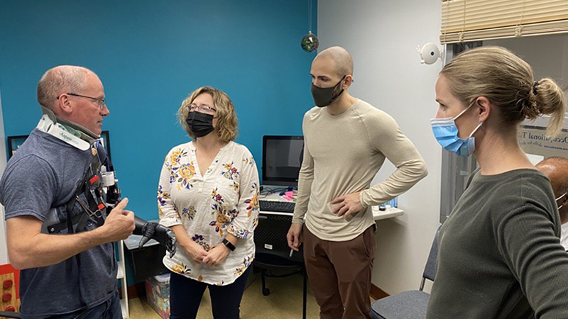 Left to right: Troy Chapman; Wendy Hill, research occupational therapist; Dan Dafonseca, prosthetics research technician; Heather Daley (BSkin'06, BEd'06, MSESS'09), research prosthetist. Photo credit: Jeremy Elder-Jubelin.