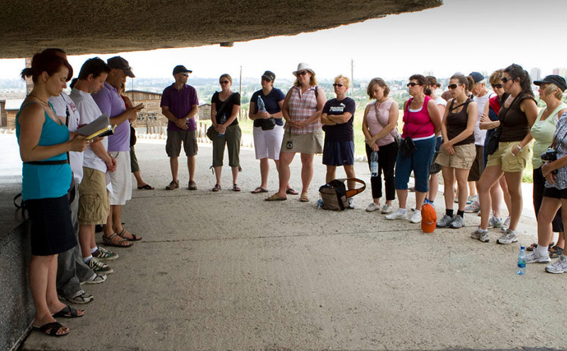 A group holding a memorial at Majdenek during the March for Life in 2010, where Dr. Cheryl Fury met the late Holocaust survivor and author Vera Schiff. (Photo courtesy Michael Rajzman).