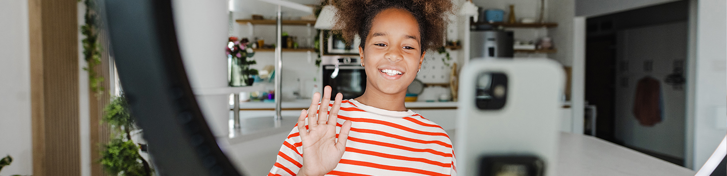 Photo of a young individual waving