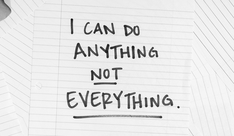 A piece of lined paper that says "I can do anything, not everything"