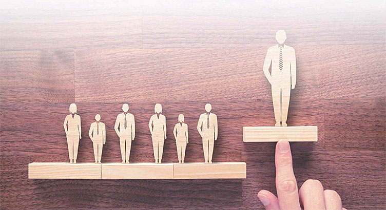 Wooden figures of people in suits