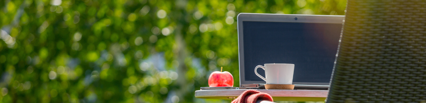 Laptop on a protable desk outside