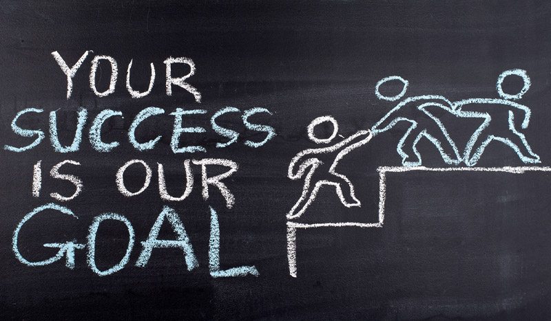 Photo of a blackboard that says: Your success is our goal