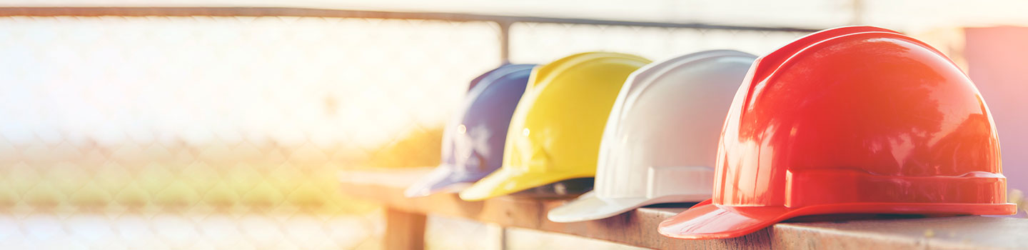 Safety hats on a bench