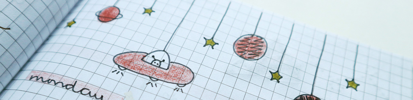 Drawing in the top of a notebook