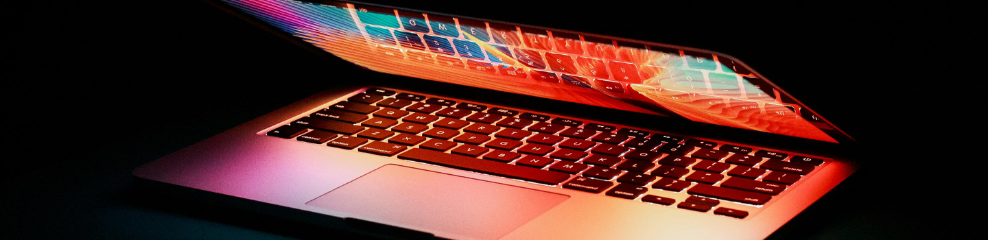 A laptop with a colourful image on it