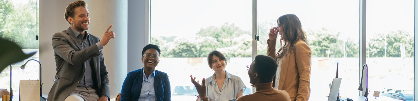 Photograph of employees in a meeting