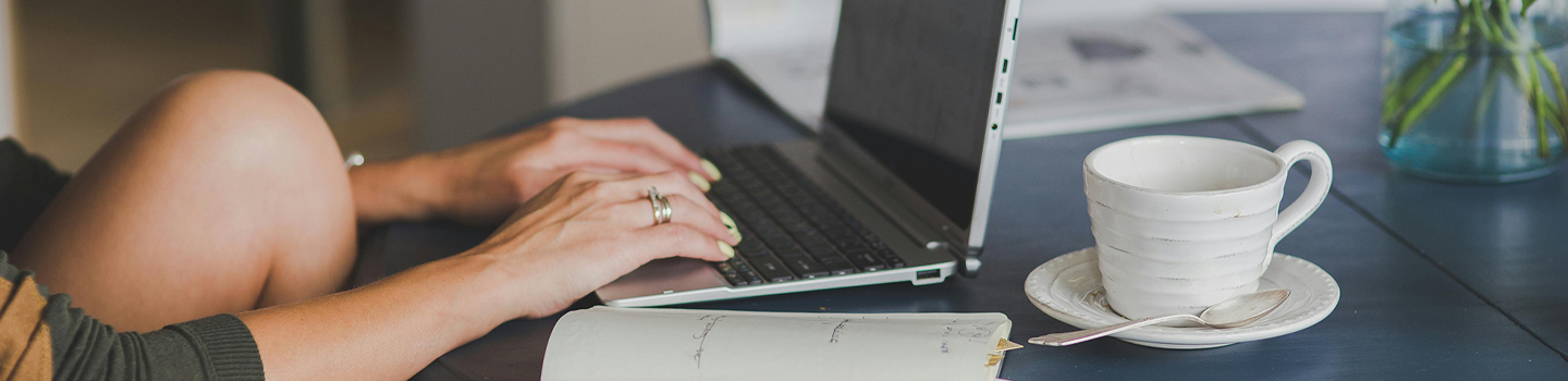 Photograph of a person using a laptop
