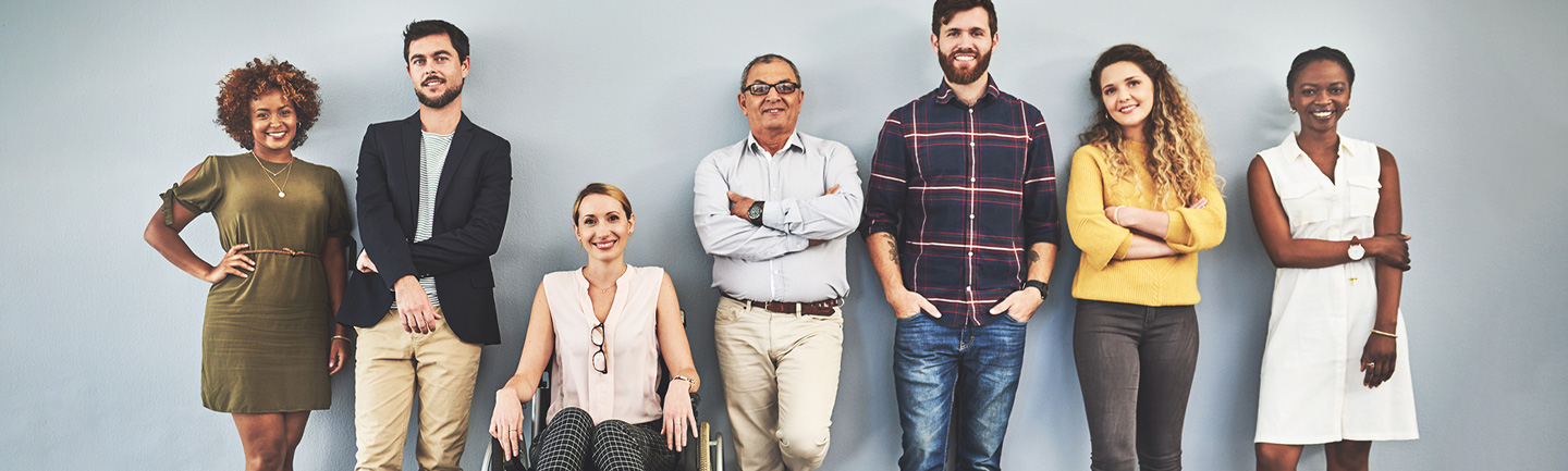 A diverse group of people standing next to each other