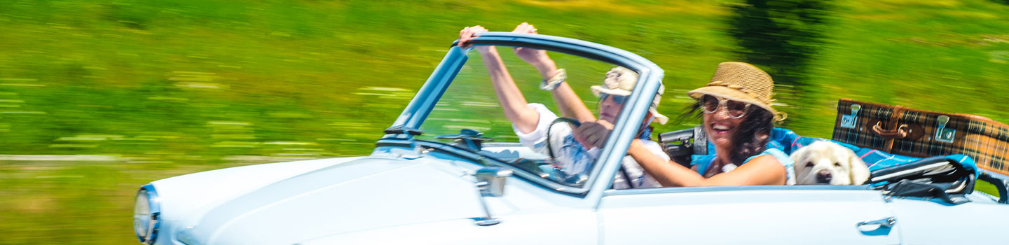 Photo of people driving in a car