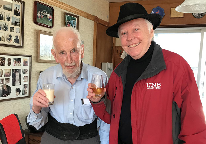 Angus receiving a birthday toast from Dr. John McLaughlin