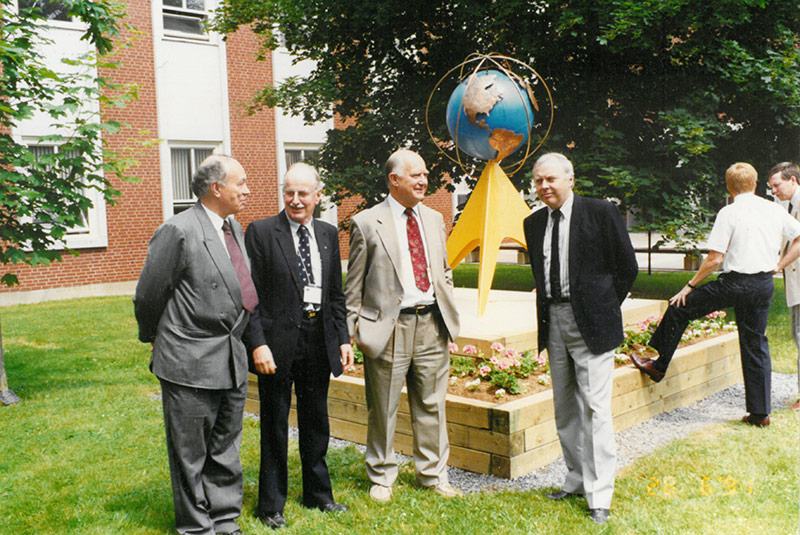 Unveiling of the sculpture to commemorate the department's 30th anniversary held in June 1991. From left to right: Gottfried Konecny, Angus Hamilton, Adam Chrzanowski, and John McLaughlin