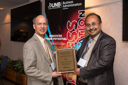 Dr. Devashis Mitra (dean) and Dr. Basu Sharma t the 2015 Atlantic Business Schools Conference accepting the faculty research award.