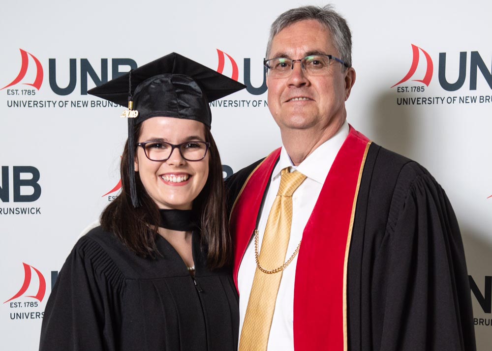 Hannah Meneley with UNB president Eddy Campbell after her graduation ceremony.