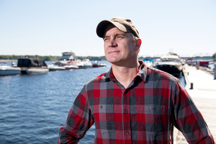 Tommi Linnansaari, a research associate with the Canadian Rivers Institute at the University of New Brunswick and the new UNB CAST Atlantic Salmon Research Chair, poses by the Saint John River in Fredericton. He will be coordinating new, innovative research projects aimed at reviving wild Atlantic salmon.