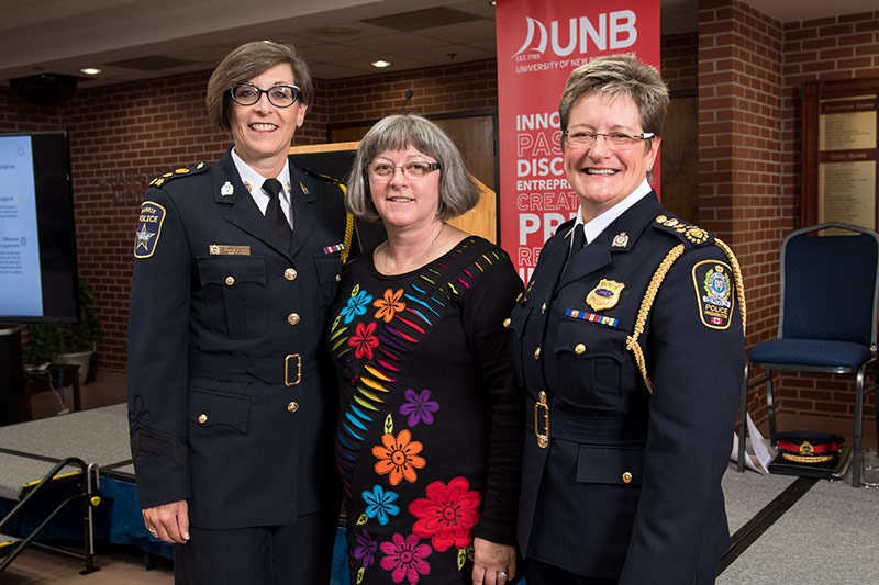 Dr. Carmen Gill, centre, at an event in 2016 announcing a National Framework for Collaborative Police Action on Intimate Partner Violence (IPV). Photo: Joy Cummings / UNB