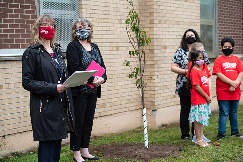 A tree-planting ceremony, held in October at Hazen White-St. Francis School, to mark the 10th anniversary of the UNB Saint John Promise Partnership and honour those who support the program. Credit: Rob Blanchard/UNB