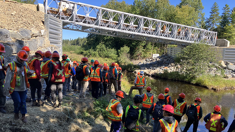 Students from the faculty of forestry and environmental management are shown visiting a J.D. Irving, Limited site at Napadogan Stream as part of their field camp course.