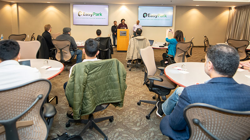 Students from the Entrepreneurship for Digital Transformation II course at the 2025 Computer Science Research Expo pitch event.