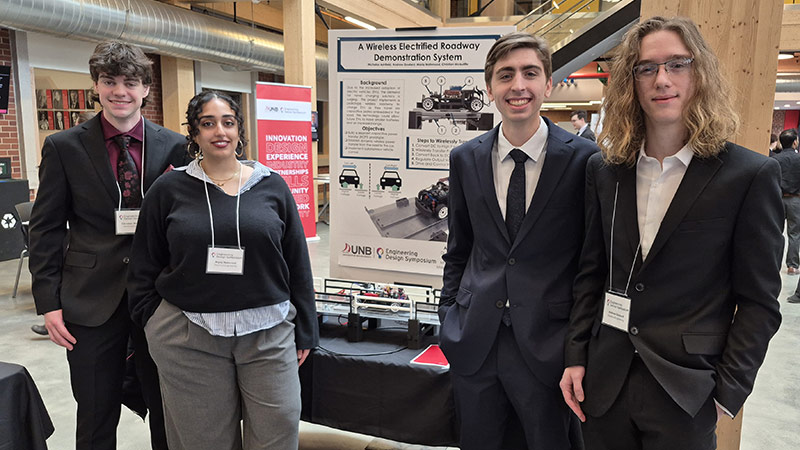 A Wireless Electrified Roadway Demonstration System, presented by (from left) Christian McAuliffe, Maria Mahmood, Nicholas Ashfield and Andrew Goulard was a 1:18-scale model of a road that delivers power to a moving electric car.