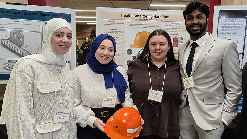 Inspired by a co‑op experience at Point Lepreau, the Hard Hat Health Monitoring System by (from left) Aya Imdoukh, Joudi Al-Lathqani, Emilee Morrell and Roshan Melvin created a health‑monitoring hard hat.
