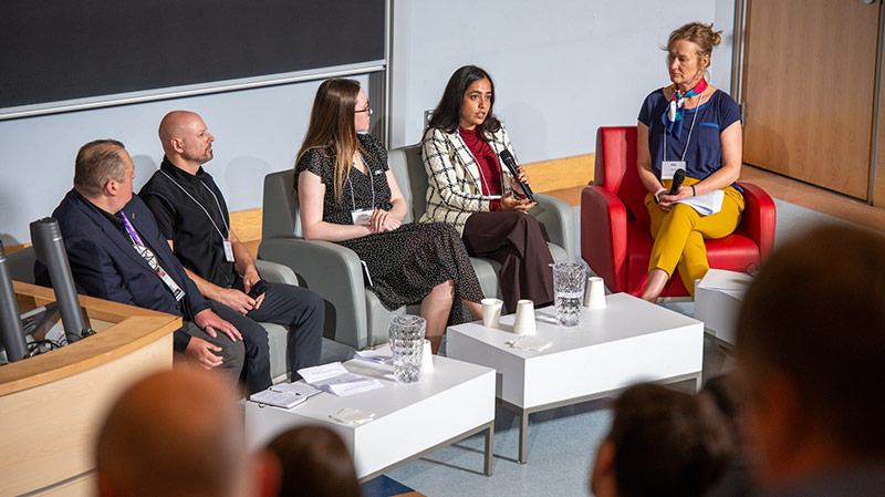 Sonya Hull, managing director of strategic industry and community partnerships at UNB’s faculty of computer science, leads a panel discussion on AI, Trust, and the Future of Work in Atlantic Canada. From left are Chris Dedam, Sesgweg Software Solutions; Charles Gervais, iTransform; Brogan Regier, AI2Market; Reeti Rohilla, Global News; and Hull.