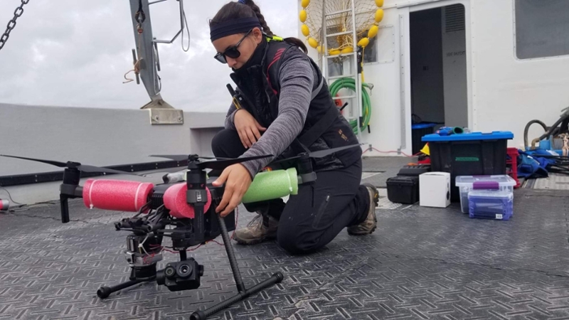 A picture of a researcher and their drone